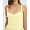 QINSEN Womens V Neck Pleated Tennis Dresses Built in Shorts Cross Back Sleeveless Athletic Dress with Pockets(Yellow)