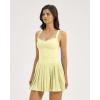 QINSEN Womens V Neck Pleated Tennis Dresses Built in Shorts Cross Back Sleeveless Athletic Dress with Pockets(Yellow)