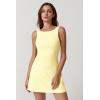 QINSEN Womens Open Back Tennis Dress Sleeveless Built in Shorts Golf Athletic Dress with Pockets(Baby Yellow)