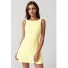 QINSEN Womens Open Back Tennis Dress Sleeveless Built in Shorts Golf Athletic Dress with Pockets(Baby Yellow)